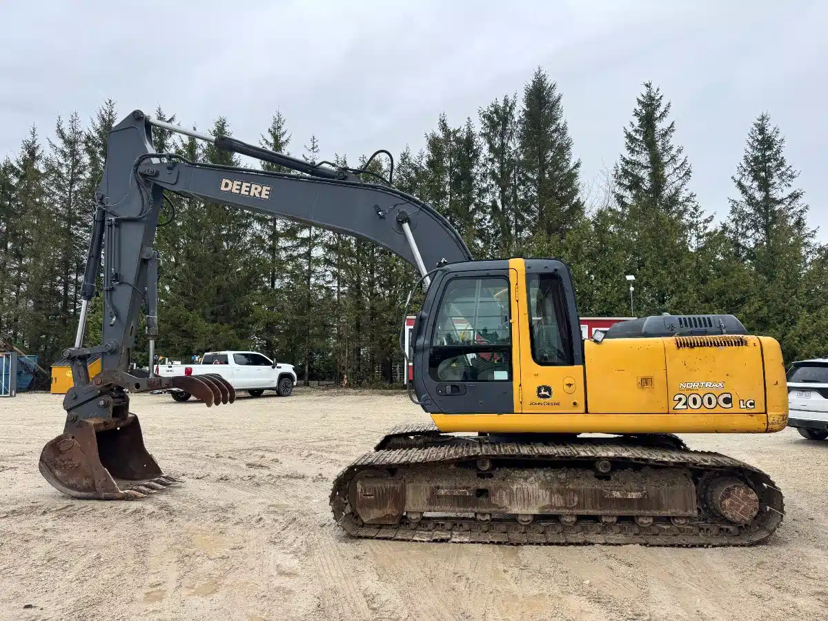 John Deere 200C LC excavator parked with its boom lowered.