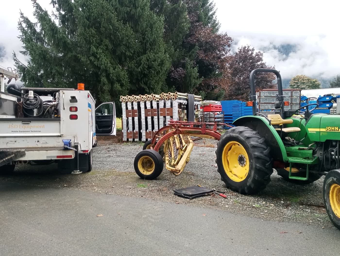 Hay rake in a Fraser Valley field, the implements and harvest equipment JSD services across farms and acreages.